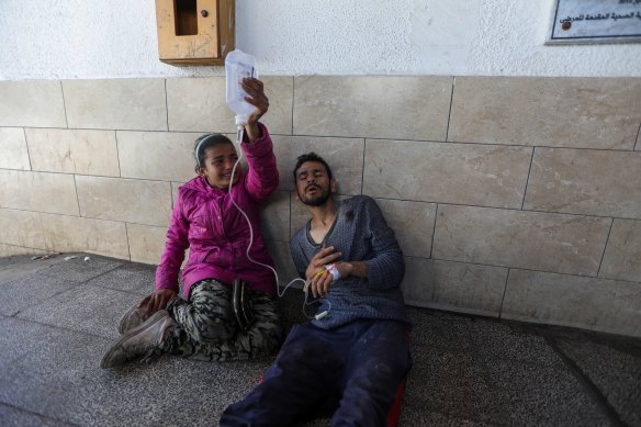 Palestinians injured in the airstrike wait for treatment in hospital. The Weir House aid and distribution centre run by the United Nations Relief and Works Agency for Palestine refugees was damaged in Israel airstrikes on Wednesday. Hamas said it killed four people including a UN worker.