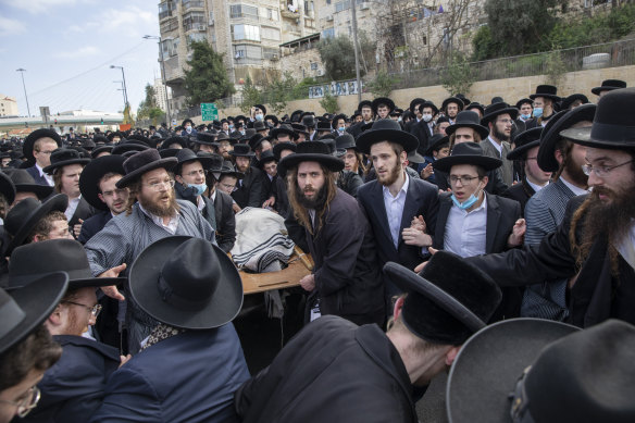 Ultra-Orthodox Jews carry the body of prominent rabbi Meshulam Soloveitchik during his funeral in Jerusalem, on Sunday, January 31.