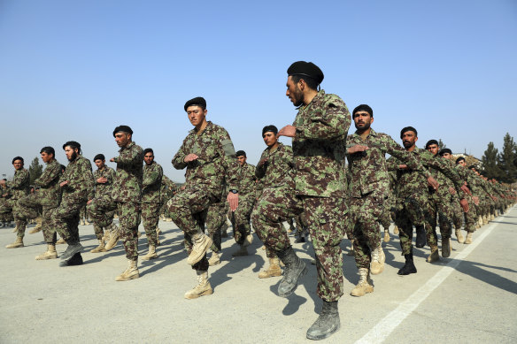 Afghan National Army soldiers march at their graduation ceremony in January.