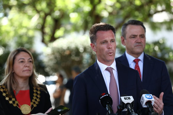 Former Bayside mayor Dr Christina Curry, pictured with Premier Chris Minns and Sports Minister Steve Kamper, is also a director of the Randwick Club. A proposed party rule change would force her to resign from the board if she hopes to continue as a councillor. 