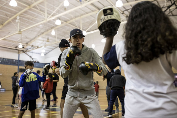 Ryan Harkins is one of 200 people in his community that rise at dawn three times a week for boxing. 
