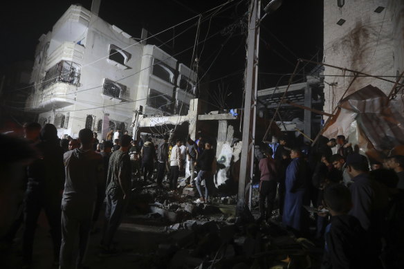 Palestinians inspect the rubble of destroyed buildings after an Israeli airstrike on a Rafah refugee camp on Wednesday. Palestinian medics said several residents, including children, were killed.