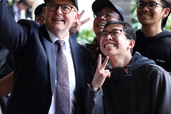 Anthony Albanese takes selfies with people in Perth, where he addressed Peter Dutton’s comments on the Voice.