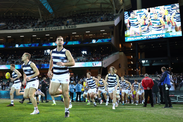 The Cats run out on to Adelaide Oval, one of the venues on standby for the AFL grand final.