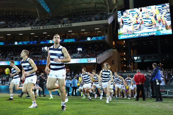 The Cats run out on to Adelaide Oval, one of the venues on standby for the AFL grand final.