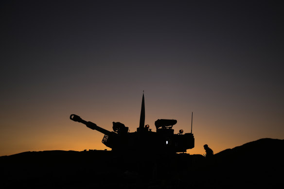 Israeli artillery train their guns towards the Gaza strip on November 21. A pause in fighting is part of the deal.