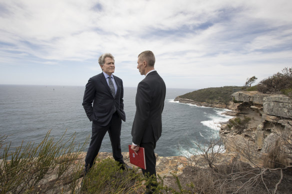Steve Johnson, left, and Detective Chief Inspector Peter Yeomans in 2018 on the cliff at North Head, the site of Scott Johnson's death.