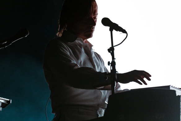 A simple but effective light show turns the musicians into silhouettes, coiled with smoke.