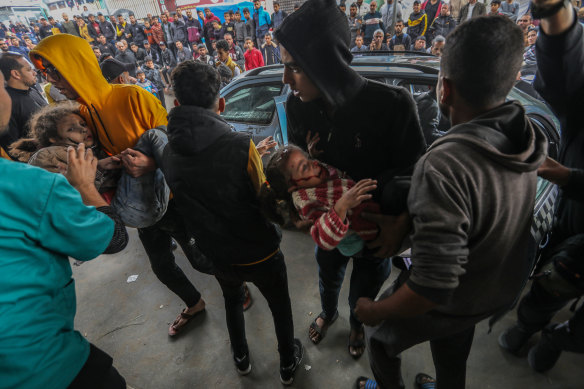 Palestinian children injured in an Israeli airstrike arrive at Nasser Medical Hospital in Gaza.