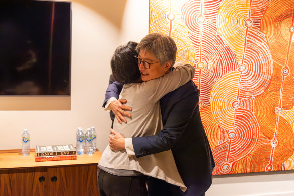 Foreign Minister Penny Wong and journalist Cheng Lei embrace as she returns to Australia.