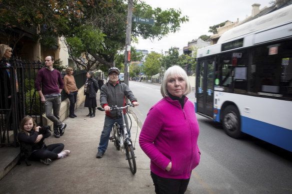 Glebe resident Di Anstey (front) and her neighbours say a pop-up cycleway on Bridge Road makes life more difficult for them.
