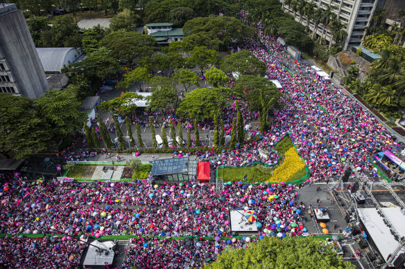 Hundreds of thousands line Ayala Avenue in Makati City, Manila, at the final Robredo rally ahead of Monday’s presidential election.