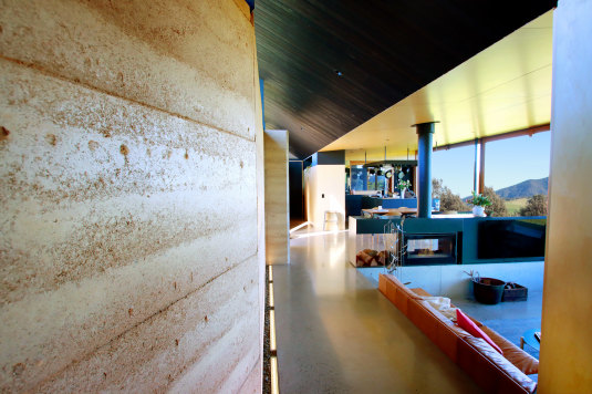The Mystery Bay’s houses rammed earth walls are longer than an Olympic pool and nearly a metre wide in some spots.