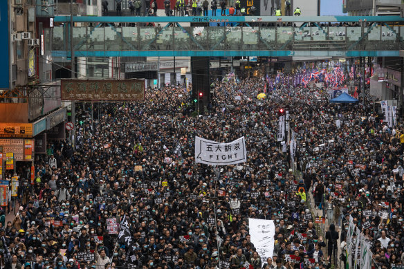 Protesters take to the streets of Causeway Bay in Hong Kong on January 1, 2020. 