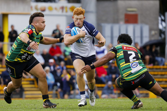 Eastwood's Tane Edmed looks to bust through Dordon's line.