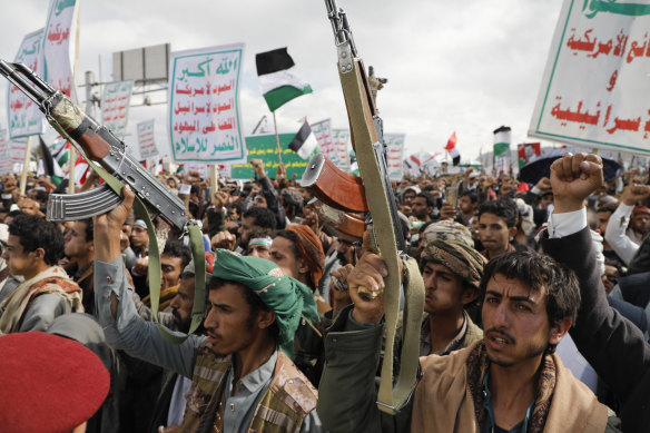 Houthi supporters take part in a march against US air strikes on Yemen and the Israeli attack on Palestinians on Friday. 