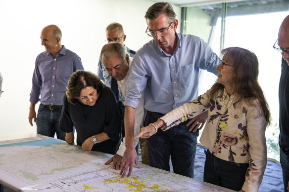 Premier Perrottet with Lismore MP Janelle Saffin overlooking regional maps during the announcement.