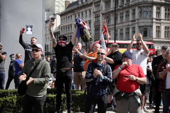 Demonstrators in front of the concealed statue of Winston Churchill in London's Parliament Square on June 13.
