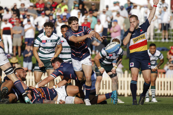 Teddy Wilson clears the ball for Easts.