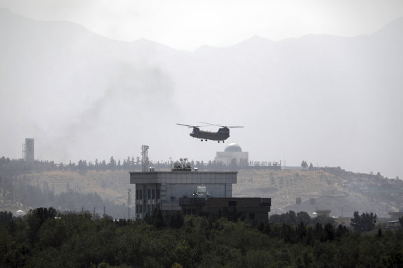 A US Chinook helicopter flies over the American embassy in Kabul, Afghanistan on Sunday.