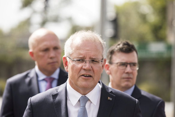 Former prime minister Scott Morrison.  with then-minister for home affairs Peter Dutton and then-minister for cities, urban infrastructure and population Alan Tudge.