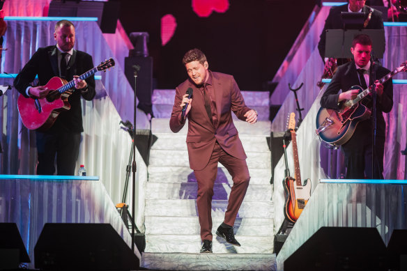 Michael Buble danced his way through a joyous two-hour concert at Rod Laver Arena.