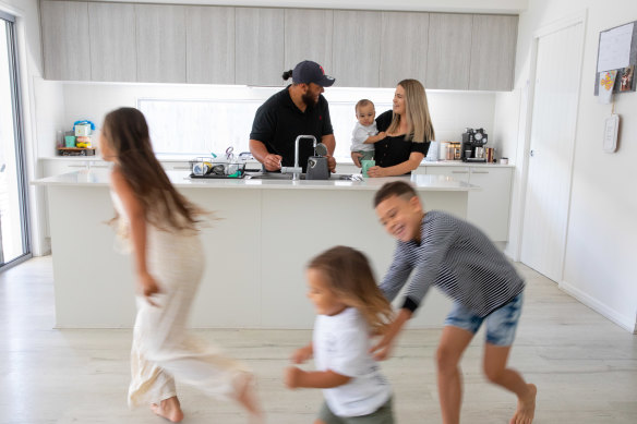 April Fletcher with husband Otto holding son Draco, as Nephi, Latrell   and Nevaeh run around at the Sunshine Coast home where the moved to from Sydney. 