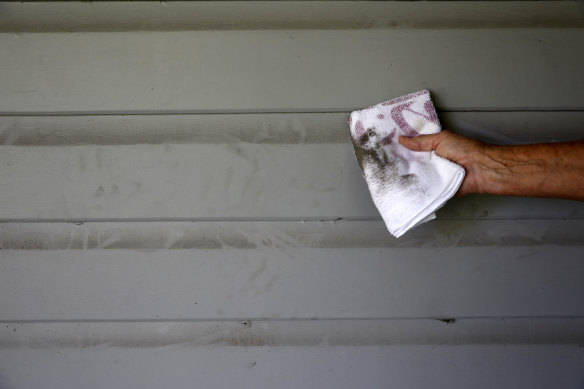 The dust sticks to walls of Margot and Michael White’s home.