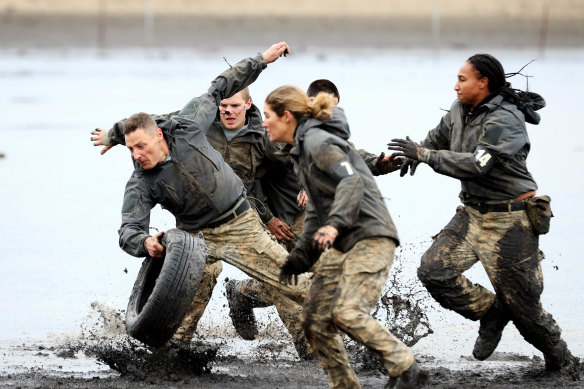 Merrick Watts, left, and Sabrina Frederick, right, with some of the other celebrities who signed up for a 'beasting' on SAS Australia.