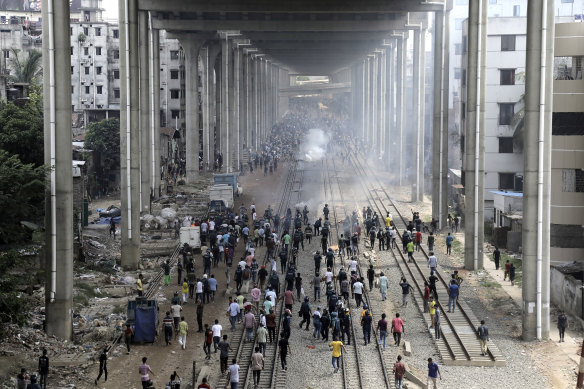 Students clash with police in Dhaka.