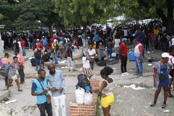 Haitians waiting to board a flight to Nicaragua gather  in Port-au-Prince, Haiti after the government banned all charter flights. 