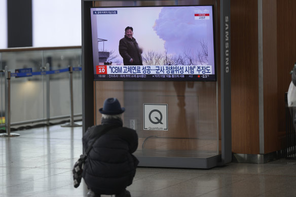 A TV shows a file image of North Korean leader Kim Jong-un during a news program at Seoul Railway Station on New Year’s Eve.