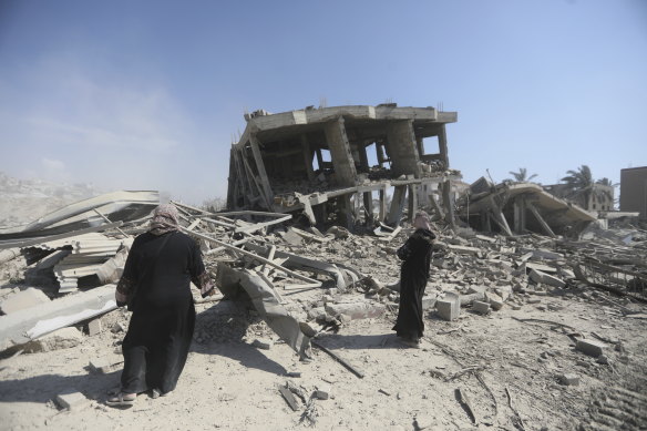 A Palestinian looks at the destruction left by the Israeli air and ground offensive in Khan Younis.