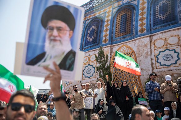 Demonstrators in Tehran protesting against Israel’s air attacks on Iran hold posters of Supreme Leader Ayatollah Ali Khamenei.