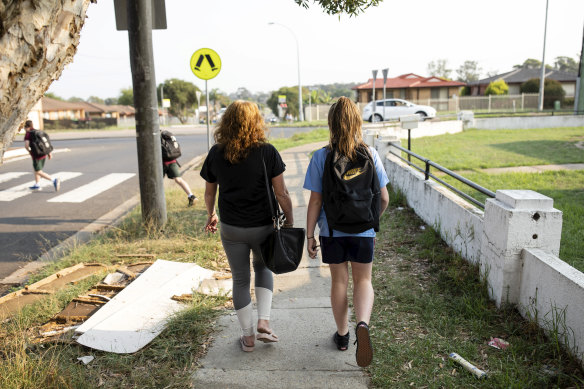 Lynette walks Jayde to school while the twins run ahead.