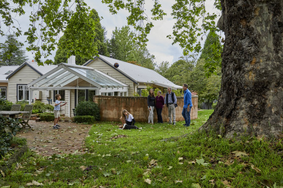 Happy home: children Manning and Audrey with mother Zoe Flanagan-Field, Zoe’s parents, Robin and Warwick Mosman, and father Craig Field, outside the home they share in the Blue Mountains.