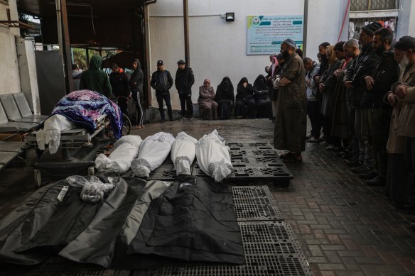 Relatives collect the bodies of some people killed in Gaza last month.