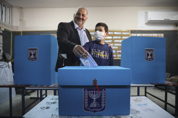 Mansour Abbas, leader of the United Arab List, votes for Israel’s parliamentary election at a polling station in Maghar, Israel, Tuesday, March. 23, 2021. 