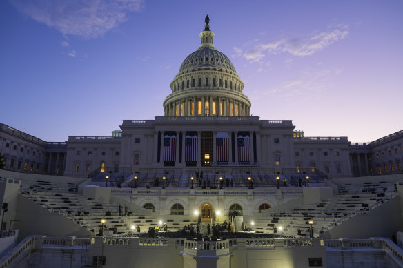 The sun rises behind the US Capitol as a rehearsal begins on the West Front ahead of President-elect Donald Trump’s inauguration