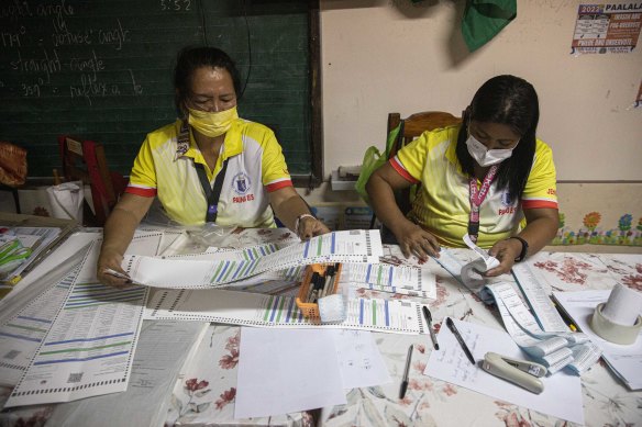 Election officials destroy unused ballots on Monday.