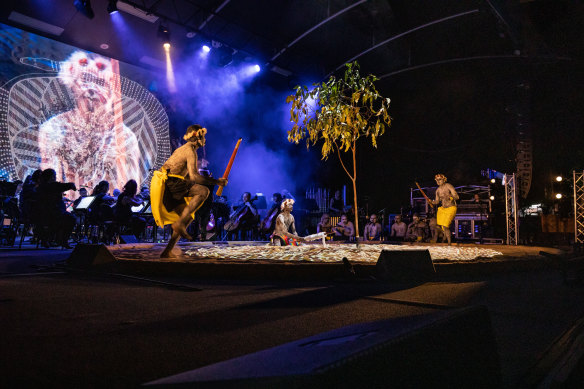 Yolŋu dancers perform with the Darwin Symphony Orchestra in Buŋgul.