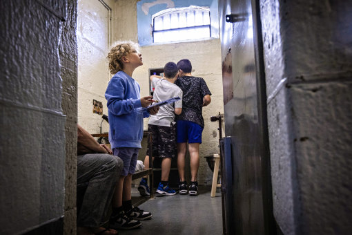 Working it out: Liam and other children on the new tour of the former Pentridge Prison H Division.