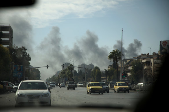 Smoke rises after an IDF strike reportedly targeted ammunition depots near Mezzeh Air Base in Damascus, Syria. 
