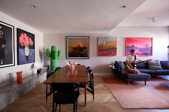 Works by Australian artists line the lounge/dining room walls. The Featherston “Scape” dining chairs are from Grazia & Co, the Cactus coat rack is from Living Edge.
