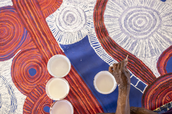 Betty Kuntiwa Pumani working on her commission, <i>Antara</i>, for The National. See it at the MCA.