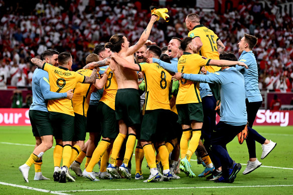 The Socceroos celebrate their penalty shootout win over Peru.