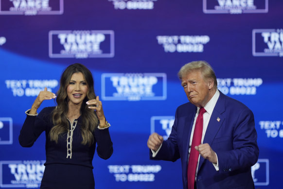 Republican presidential nominee Donald Trump and South Dakota Governor Kristi Noem dance to YMCA at the Greater Philadelphia Expo Centre & Fairgrounds, in Oaks, Pennsylvania.