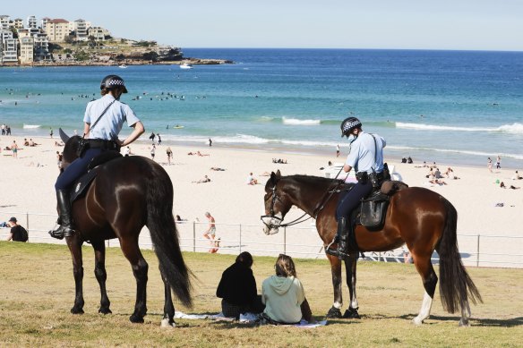 Police patrol Bondi Beach during a COVID lockdown in August 2021.