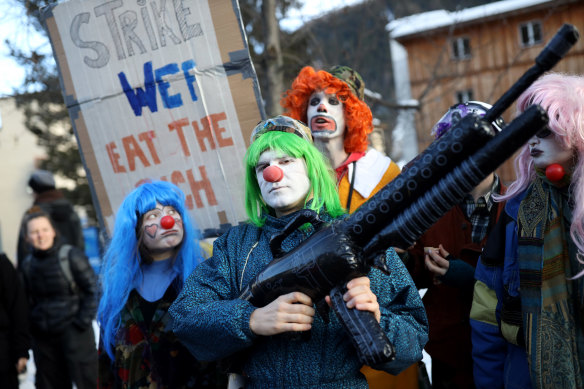 Protesters rally against the World Economic Forum, a meeting of influential executives, policy makers and bankers.