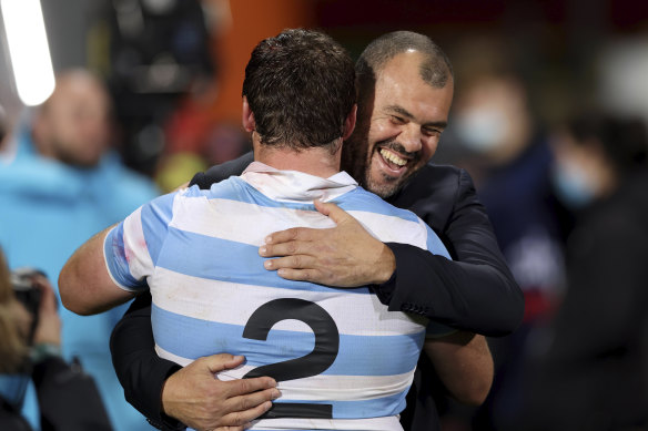 Michael Cheika and Pumas captain Julian Montoya celebrate victory over the All Blacks.